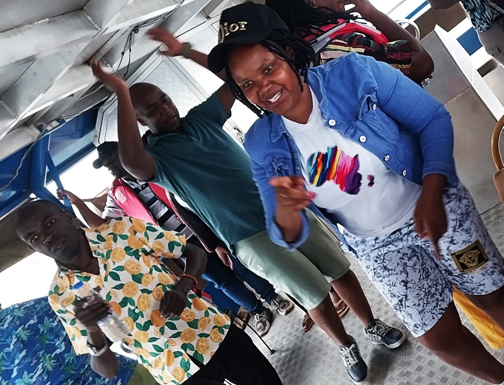 The Unstoppable Mother: Dancing on Water

From the mountains of Kapchorwa, we returned to Jinja, our bodies tired but our spirits soaring to the heights. Our final day was a grand celebration, a victory lap that began with a boat cruise to the historical Source of the Nile. The boat was a floating party, filled with music and laughter. As I stood on a small island, holding my baby, I watched in profound wonder as the calm lake water began its long, mighty journey north. It was a powerful, humbling sight.