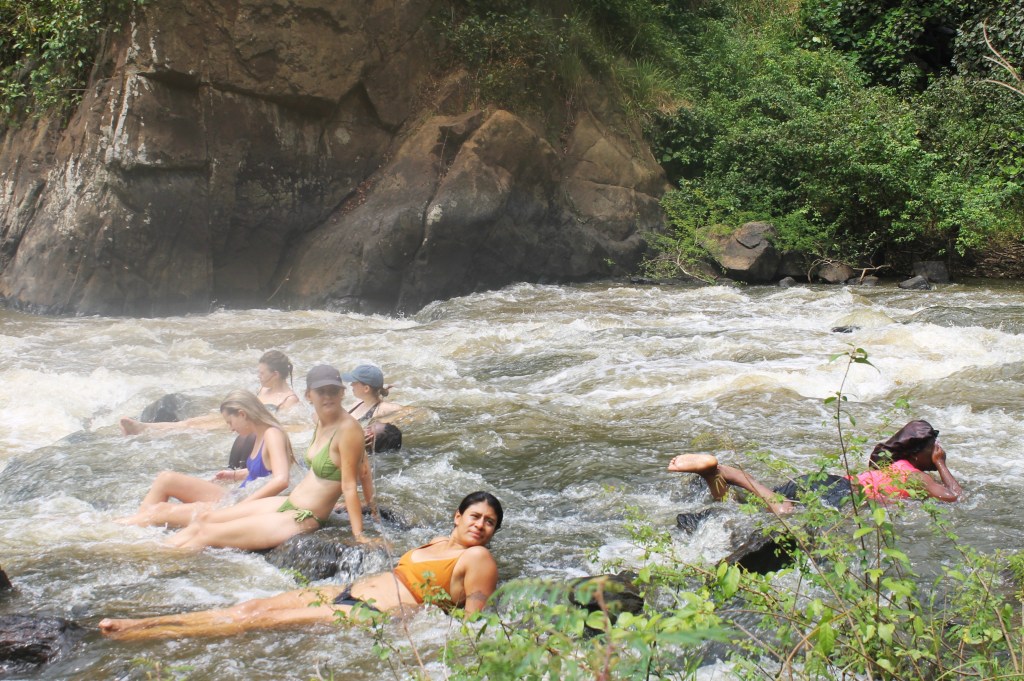 The Descent into the Abyss of Antiquity
From our high-altitude vantage point, the panorama was nothing short of a geographical masterpiece, a visual feast that defied the limits of a standard wide-angle lens. Lake George shimmered in the distance like a fallen piece of the sky, while the plains of Queen Elizabeth National Park reclined lazily against the jagged, snow-dusted spine of the Rwenzori Mountains. We were greeted by the natives of Karubuguma, a vibrant tapestry of indigenous Batagwenda and migrant Bakiga, whose oral histories added a layer of cultural seasoning to our physical toil. Their stories spoke of the gorge not just as a landmark, but as a living ancestor. 